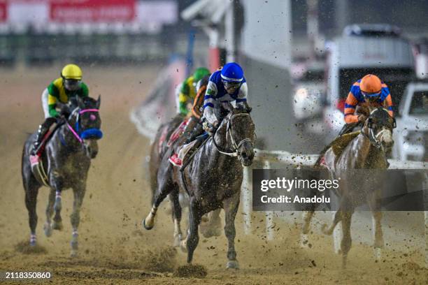 Riders compete for the 2000-meter race within the 2024 Dubai World Cup at Meydan Racecourse in Dubai, United Arab Emirates on March 30, 2024.