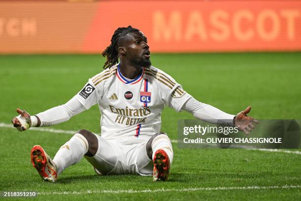 Lyon's Guinean Portuguese forward Mama Balde reacts during the French L1 football match between Olympique Lyonnais and Stade de Reims at The Groupama...