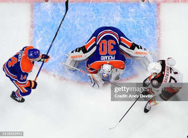 Goaltender Calvin Pickard of the Edmonton Oilers smothers the puck during the game against the Anaheim Ducks at Rogers Place on March 30 in Edmonton,...