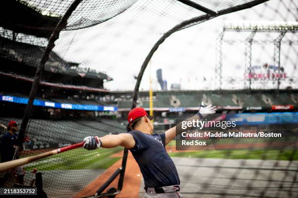 Masataka Yoshida of the Boston Red Sox takes batting practice before a game against the Seattle Mariners at T-Mobile Park on March 30, 2024 in...