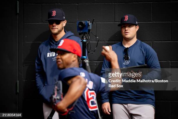 Pitching Coach Andrew Bailey of the Boston Red Sox watches as Brayan Bello of the Boston Red Sox throws before a game against the Seattle Mariners at...