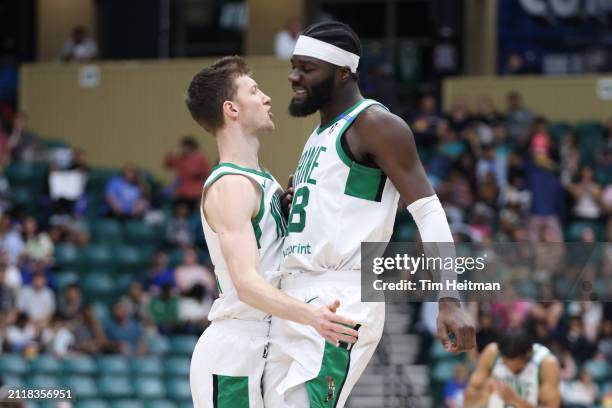 Drew Peterson and Neemias Queta of the Maine Celtics react after a basket during the game against the Texas Legends on March 30, 2024 at Comerica...