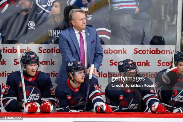 Head Coach Rick Bowness of the Winnipeg Jets looks on from the bench during third period action against the Ottawa Senators at the Canada Life Centre...
