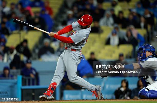 Will Smith of the Los Angeles Dodgers loses his glove as he is called for catcher interference against Matt Carpenter of the St. Louis Cardinals to...