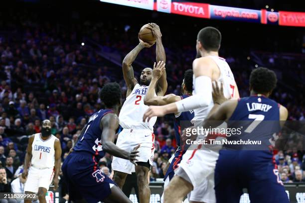 Kawhi Leonard of the LA Clippers shoots over Mo Bamba of the Philadelphia 76ers during the first quarter at the Wells Fargo Center on March 27, 2024...