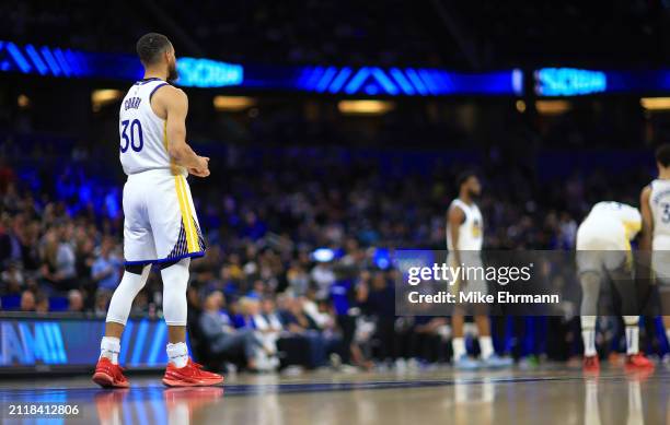 Stephen Curry of the Golden State Warriors looks on during a game against the Orlando Magic at Kia Center on March 27, 2024 in Orlando, Florida. NOTE...