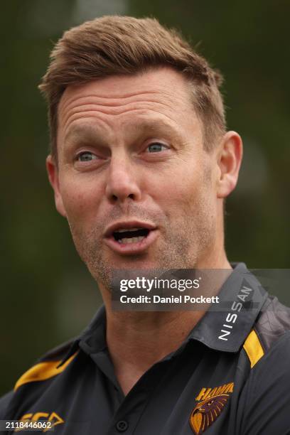 Sam Mitchell, Senior Coach of the Hawks speaks to media during a Hawthorn Hawks AFL training session at Waverley Park on March 28, 2024 in Melbourne,...