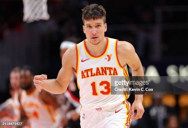 Bogdan Bogdanovic of the Atlanta Hawks reacts after hitting a three-point basket against the Portland Trail Blazers during the first quarter at State...