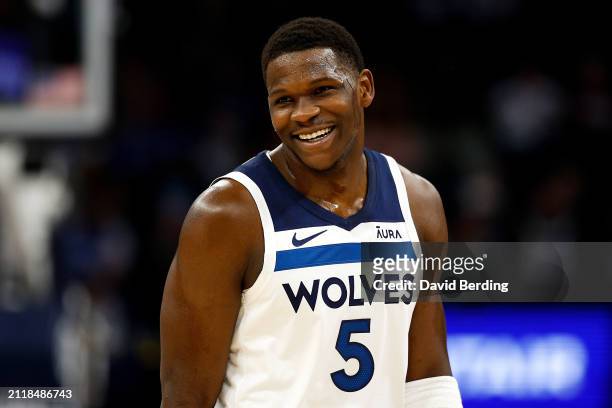 Anthony Edwards of the Minnesota Timberwolves smiles in the first quarter against the Detroit Pistons at Target Center on March 27, 2024 in...