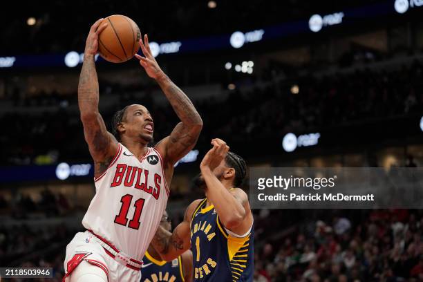 DeMar DeRozan of the Chicago Bulls shoots the ball against Obi Toppin of the Indiana Pacers during the first half at the United Center on March 27,...