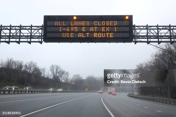 Sign signals motorist of the closure of I-695 following the collapse of the Francis Scott Key Bridge after the cargo ship Dali crashed into it, March...