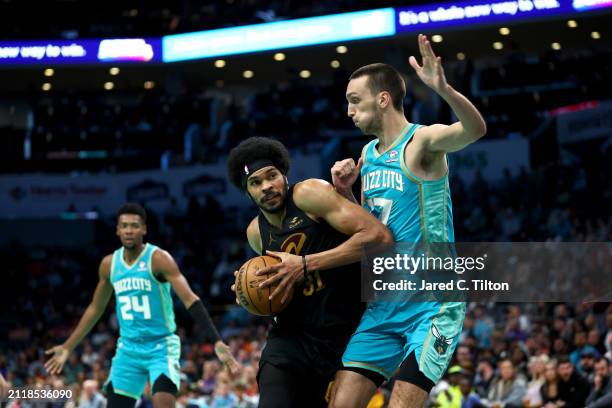 Jarrett Allen of the Cleveland Cavaliers drives to the basket against Aleksej Pokusevski of the Charlotte Hornets during the second half of the game...