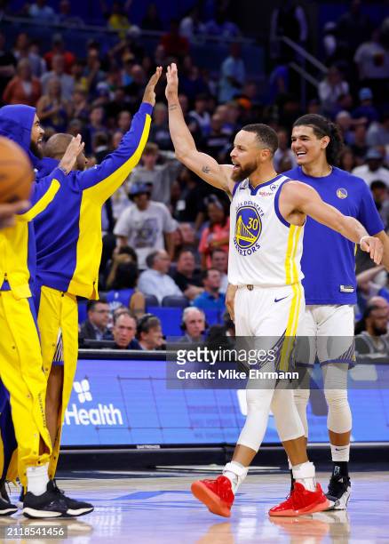 Stephen Curry of the Golden State Warriors reacts to winning a game against the Orlando Magic at Kia Center on March 27, 2024 in Orlando, Florida....