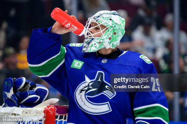 Casey DeSmith of the Vancouver Canucks takes a drink during the second period of their NHL game against the Calgary Flames at Rogers Arena on March...