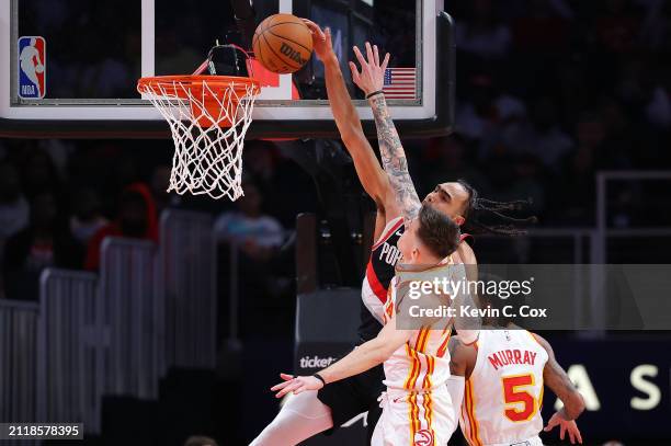 Dalano Banton of the Portland Trail Blazers dunks against Vit Krejci of the Atlanta Hawks during the fourth quarter at State Farm Arena on March 27,...