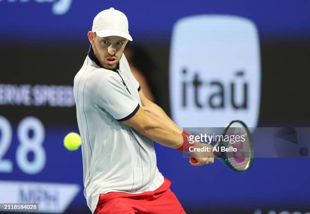 Nicolas Jarry of Chile returns a shot against Daniil Medvedev during their match on Day 12 of the Miami Open at Hard Rock Stadium on March 27, 2024...
