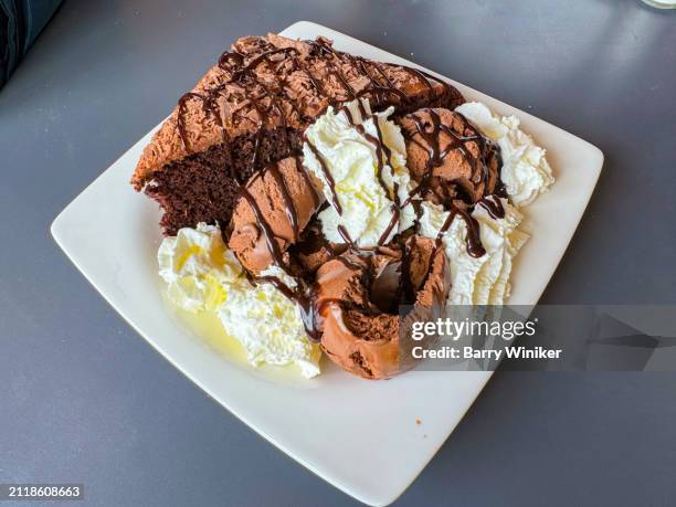 chocolate cake and ice cream - whip cream dollop stock pictures, royalty-free photos & images