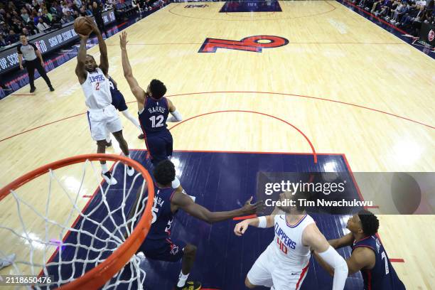 Kawhi Leonard of the LA Clippers shoots over Tobias Harris of the Philadelphia 76ers during the first quarter at the Wells Fargo Center on March 27,...