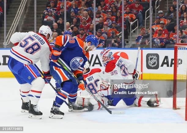 Adam Henrique of the Edmonton Oilers pursue the puck in the slot in the second period against the Montreal Canadiens on March 19, 2024 at Rogers...