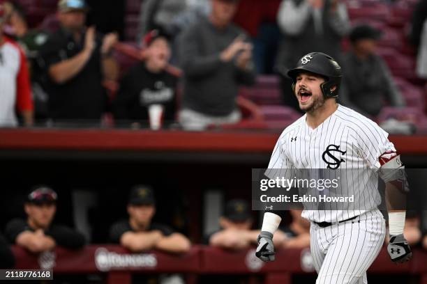Cole Messina of the South Carolina Gamecocks celebrates his home run against the Vanderbilt Commodores in the fifth inning during the second game of...