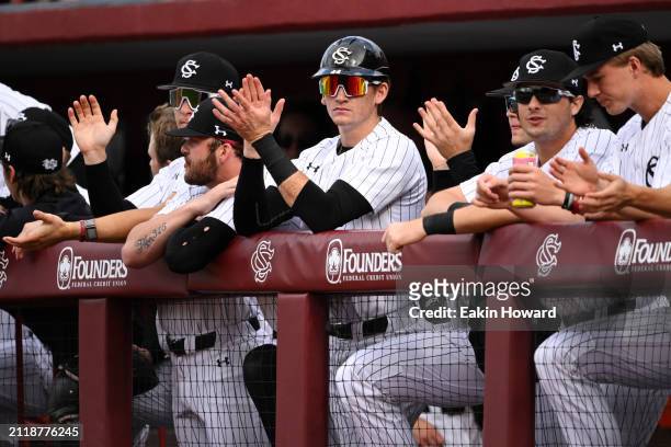 The South Carolina Gamecocks celebrate in the dugout against the Vanderbilt Commodores in the first inning during the second game of their double...