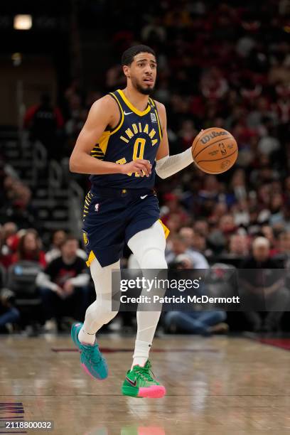 Tyrese Haliburton of the Indiana Pacers dribbles the ball during the second half against the Chicago Bulls at the United Center on March 27, 2024 in...