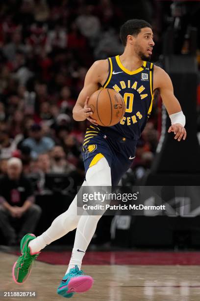Tyrese Haliburton of the Indiana Pacers dribbles the ball during the second half against the Chicago Bulls at the United Center on March 27, 2024 in...