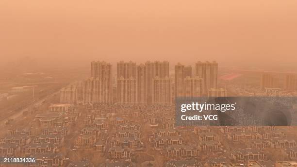 Buildings are shrouded in sand and dust on March 28, 2024 in Harbin, Heilongjiang Province of China.
