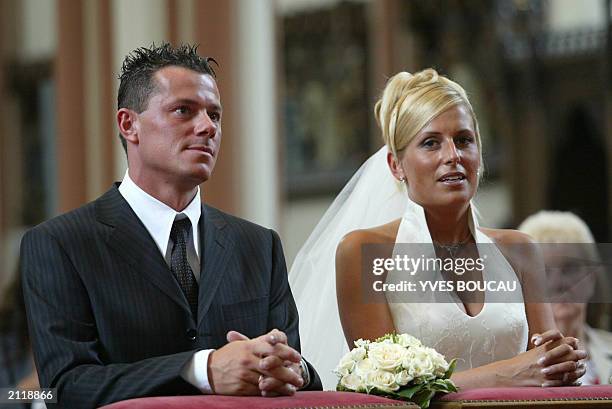 Belgian soccer player Eric Deflandre and his wife Gretchen are pictured at their religious wedding, 14 June 2003 in Brugge Saint-Kruis church. They...