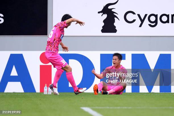 Yuji Ono of Sagan Tosu celebrates with teammate Hideto Takahashi after scoring the team's second goal during the J.League J1 match between Sagan Tosu...