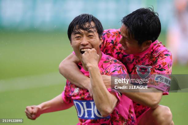 An Yong-woo of Sagan Tosu celebrates with teammate Riki Harakawa after scoring the team's third goal during the J.League J1 match between Sagan Tosu...