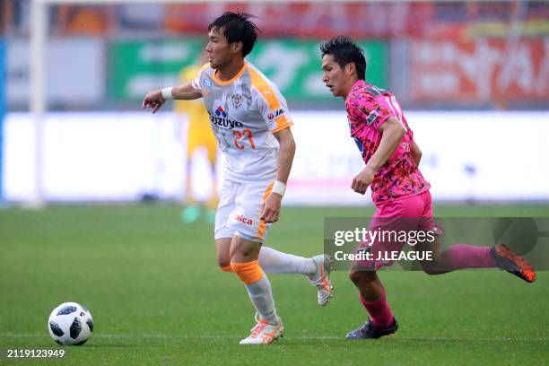 Takahiro Iida of Shimizu S-Pulse controls the ball against Riki Harakawa of Sagan Tosu during the J.League J1 match between Sagan Tosu and Shimizu...