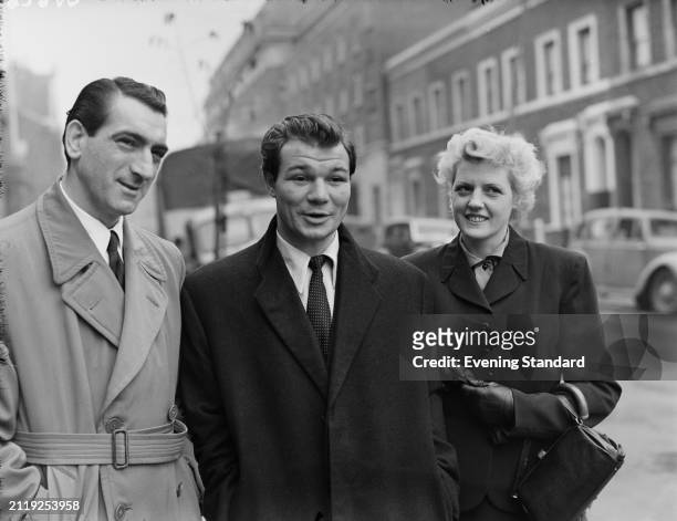 British boxer Tommy McGovern with his wife and his boxing manager Benny Huntman, October 20th 1953.