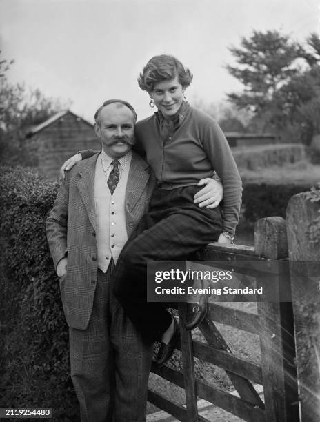 British actor and comedian Jimmy Edwards and his fiancée Anne Carew-Gibbs at her home in Cowfold, Sussex, after announcing their engagement, October...