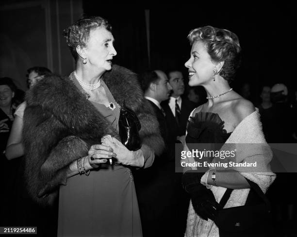 Irene Mountbatten, Marchioness of Carisbrooke , talking with British actress Hélène Cordet , October 24th 1953.