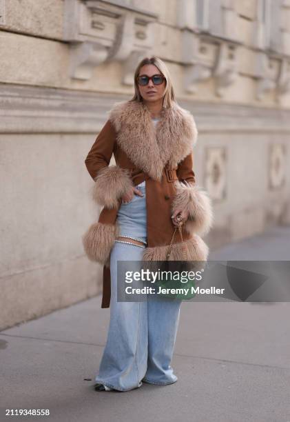 Karin Teigl seen wearing Jacques Marie Mage brown sunglasses with blue lenses, Charlotte Simone brown / beige fluffy fur suede jacket, Aera light...