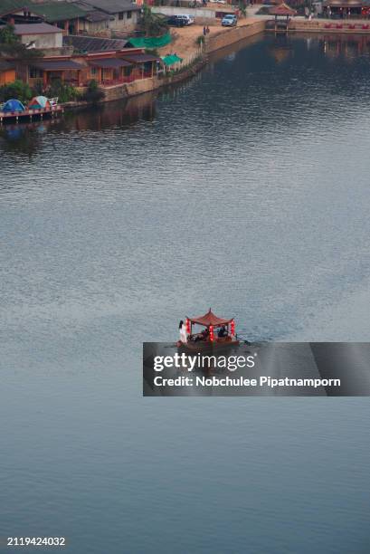 beautiful landscape ban rak thai, mae hong son, thailand, boat on the river . mist rising off the lake - mae hong son province stock pictures, royalty-free photos & images