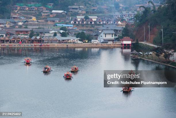 beautiful landscape ban rak thai, mae hong son, thailand, boat on the river . mist rising off the lake - mae hong son province stock pictures, royalty-free photos & images