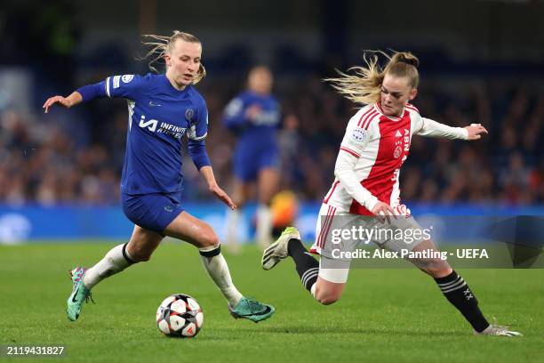 Agnes Beever-Jones of Chelsea is tackled by Milicia Keijzer of Ajax during the UEFA Women's Champions League 2023/24 Quarter Final Leg Two match...