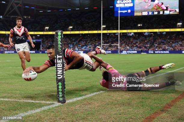 Daniel Tupou of the Roosters scores a try during the round four NRL match between Sydney Roosters and Penrith Panthers at Allianz Stadium on March 28...