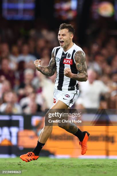 Jamie Elliott of the Magpies celebrates a goal during the round three AFL match between Brisbane Lions and Collingwood Magpies at The Gabba, on March...