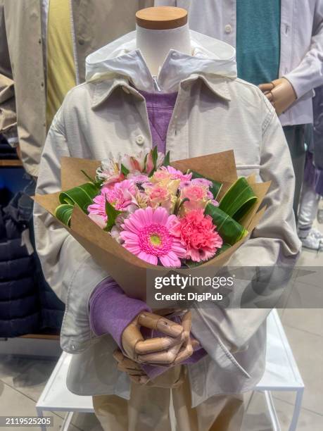 mannequin displaying spring bouquet - chuo ward tokyo stock pictures, royalty-free photos & images