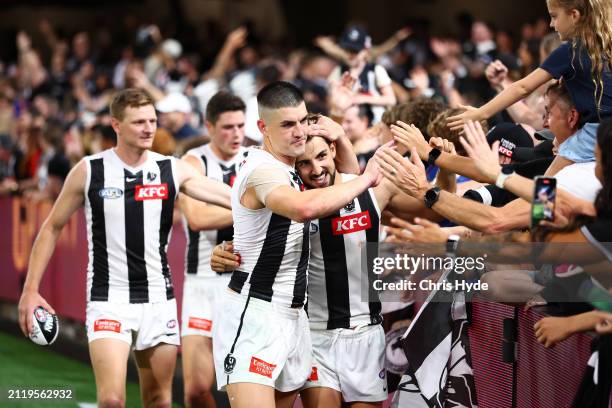 Brayden Maynard and Josh Daicos of the Magpies celebrate winning the round three AFL match between Brisbane Lions and Collingwood Magpies at The...