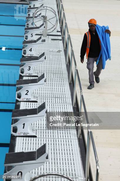 Worker is pictured during a tour of the Olympic Aquatic Centre organised by the metropole du grand Paris on March 28, 2024 in Paris, France. Paris...
