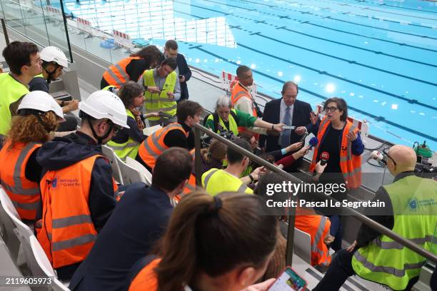 Architect, Laure Mériaud, speaks to the press during a tour of the Olympic Aquatic Centre organised by the metropole du grand Paris on March 28, 2024...