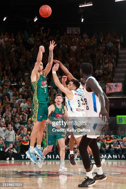 Jack Mcveigh of the JackJumpers shoots from 1/2 court on the buzzer during game four of the NBL Championship Grand Final Series between Tasmania...