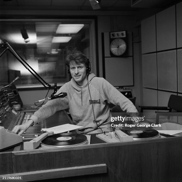 Radio DJ Charlie Gillett in a studio at Radio London, circa 1975.