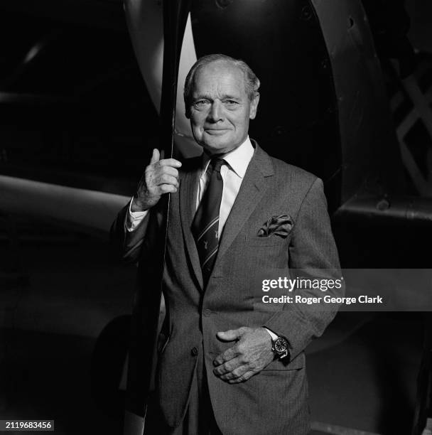 Group Captain Sir Douglas Bader posing next to a airplane's propellor at the RAF Museum, Hendon, 29th September 1976.