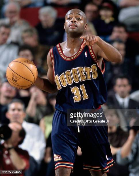 Nick Van Exel, Point Guard and Shooting Guard for the Denver Nuggets in motion dribbling the basketball down court during the NBA Pacific Division...