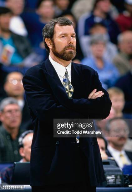 Carlesimo, Head Coach for the Golden State Warriors looks on from the sideline with arms folded during the NBA Pacific Division basketball game...